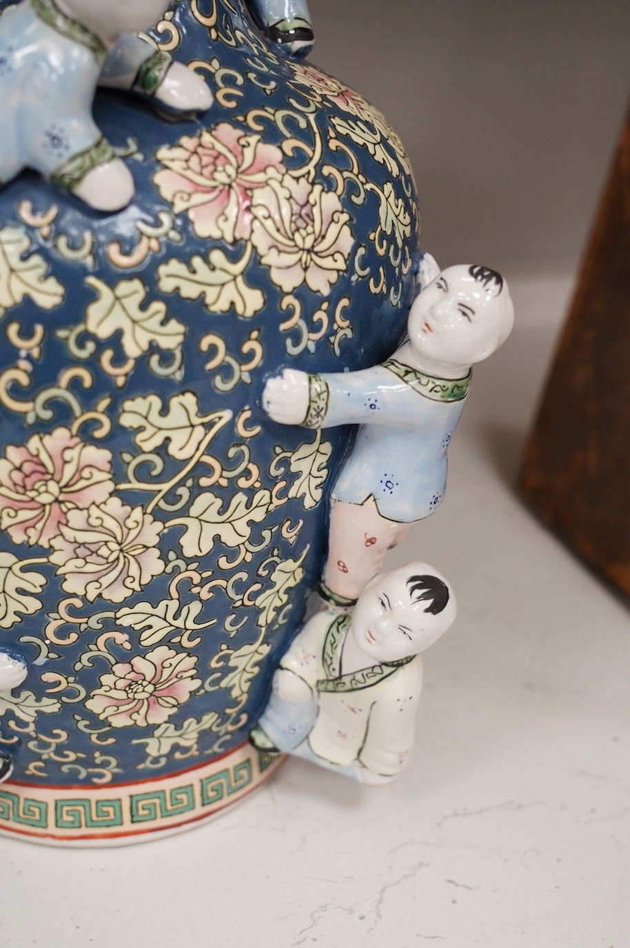 A 20th century Chinese famille rose Buddha, a ‘hundred boys’ vase and a boxed set of cloisonné boxes, vase 34cm. Condition - cloisonné boxes good, Buddha has missing decoration to robe near right hand and vase good